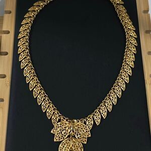 Gold tone statement necklace,
